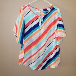 White blouse with bright colored stripes.